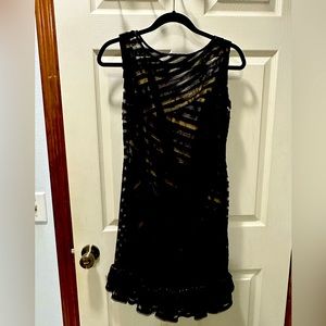 This fun little dress can be worn with sandals or pumps